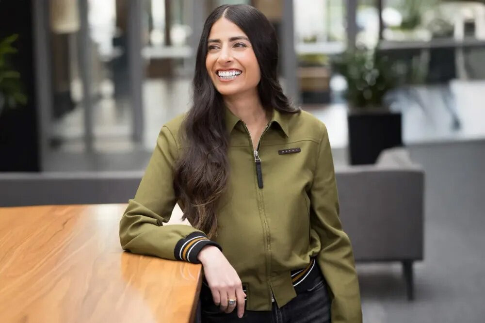 Asha Sharma Xbox ecosystem and hardware leadership executive smiling at a Microsoft corporate event