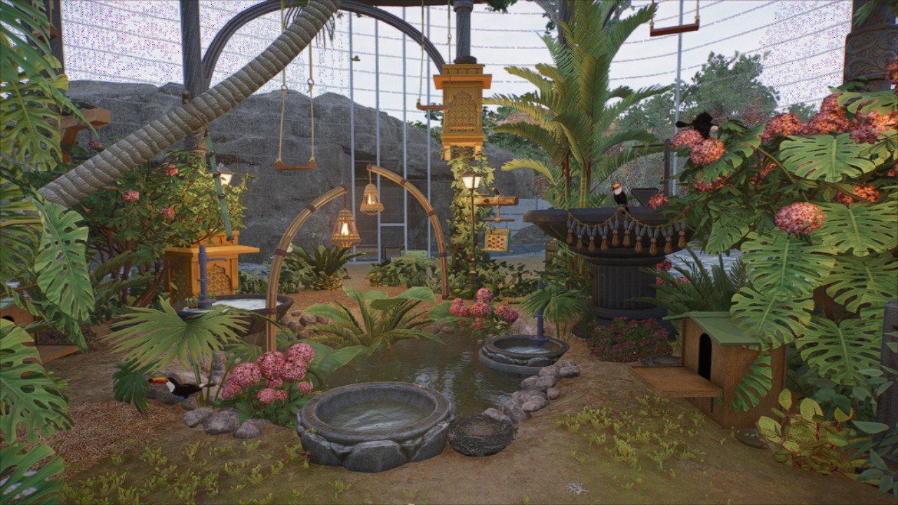 Official Planet Zoo 2 screenshot showing an aviary with birds, artificial lakes and tropical vegetation